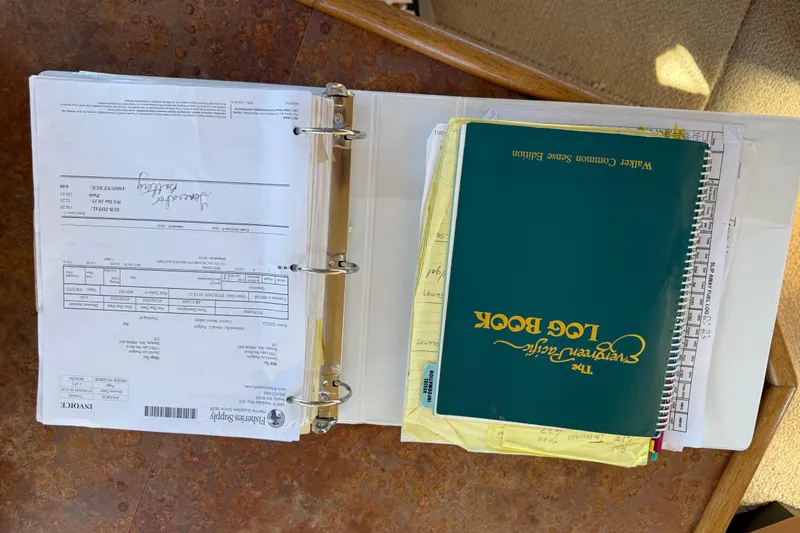 Slide: The Image of Binder with documents and log book for 1999 Bayliner 3788 Command Bridge Motoryacht. - 49
