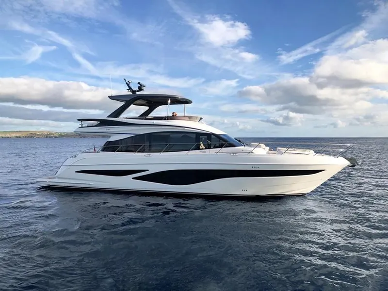The Image of 2025 Princess F65 yacht cruising on open water under a clear sky. - 0