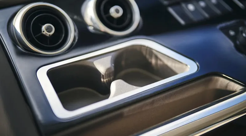 Slide: The Image of 2025 Princess F65 interior, featuring sleek cup holders and modern air vents. - 16