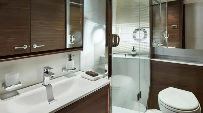 Slide: The Image of Luxurious bathroom in 2025 Princess F65 yacht with modern fixtures and wood accents. - 28