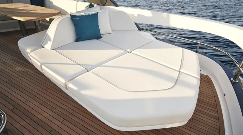 Slide: The Image of Luxurious 2025 Princess F65 yacht deck with white sunbed and blue cushion. - 6