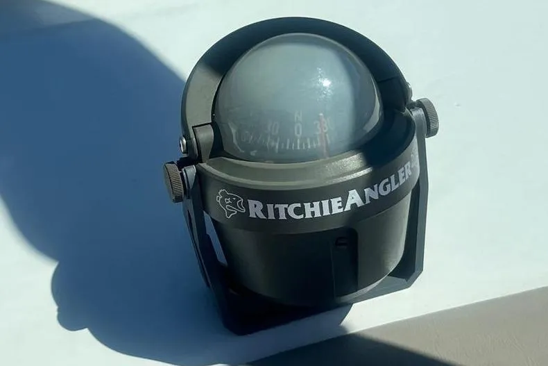 Slide: The Image of Ritchie Angler compass on a 1997 Reinell 240 boat dashboard. - 13