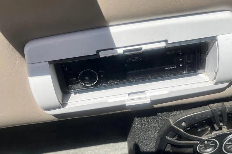 Slide: The Image of Kenwood stereo system in a 1997 Reinell 240 boat dashboard. - 15