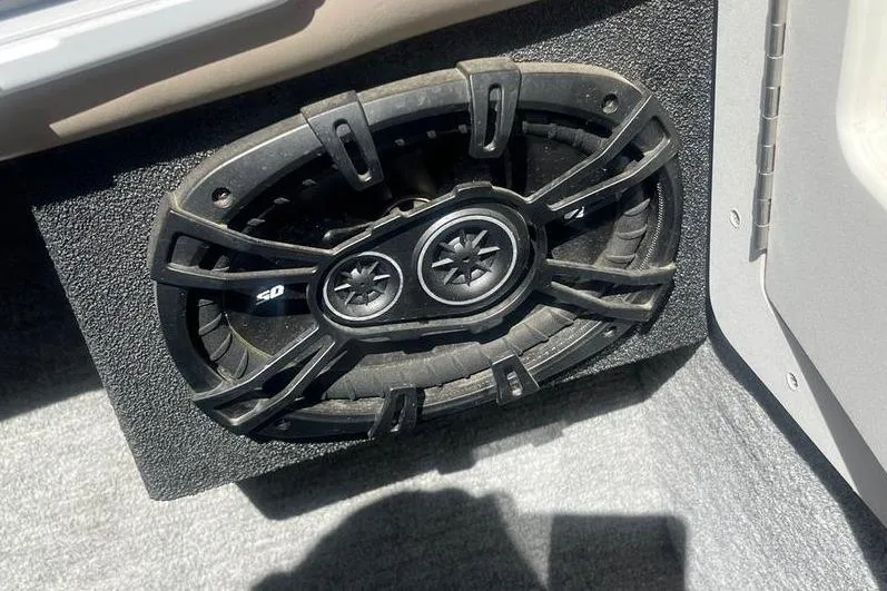 Slide: The Image of Speaker installed in a 1997 Reinell 240 boat, featuring a black grille design. - 16