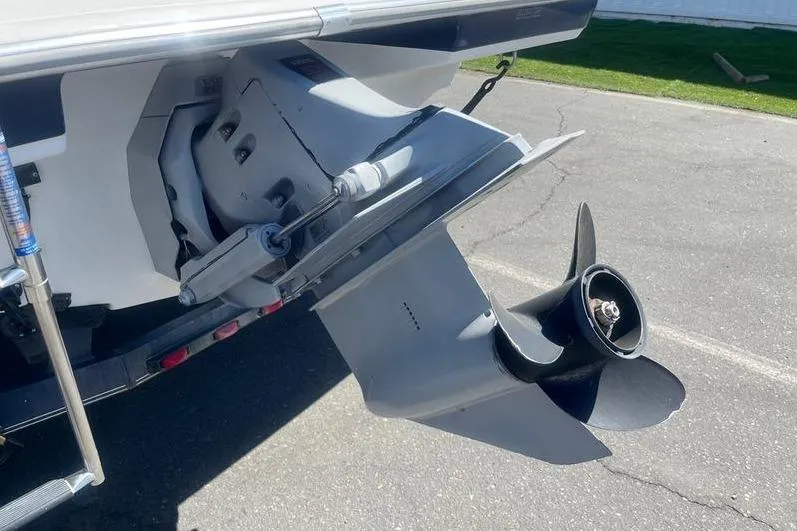 Slide: The Image of 1997 Reinell 240 boat outboard motor and propeller on a trailer. - 6
