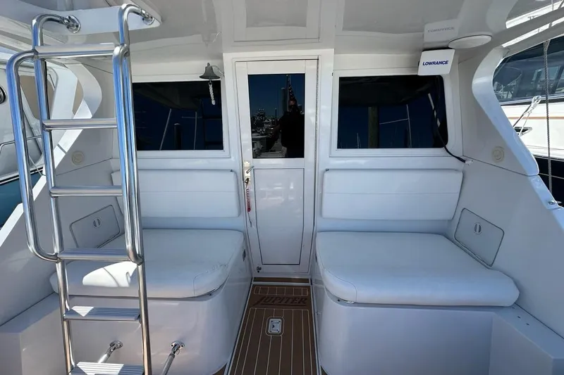 Slide: The Image of Interior of 2001 Jupiter 35 Convertible yacht with seating and ladder. - 10