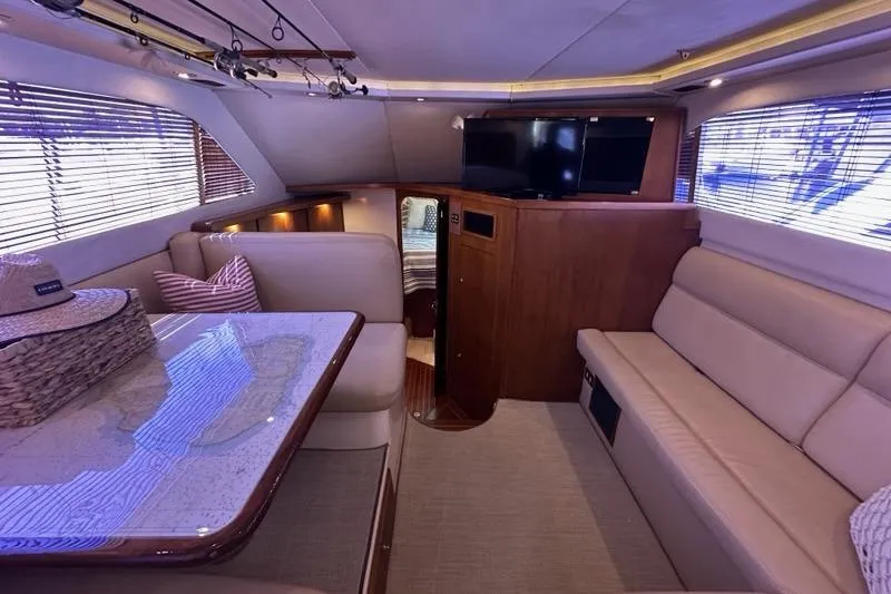 Slide: The Image of Luxurious interior of a 2001 Jupiter 35 Convertible yacht with elegant seating and decor. - 13