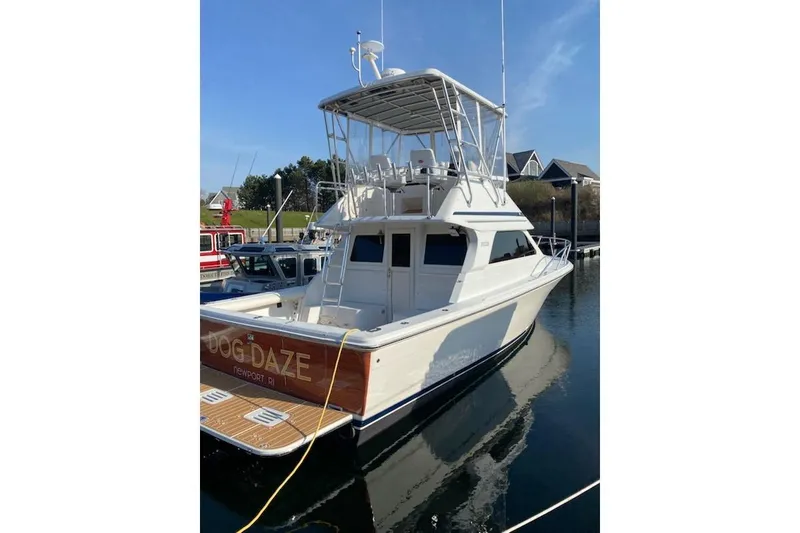 Slide: The Image of 2001 Jupiter 35 Convertible boat docked, named "Dog Daze," Newport, RI. - 2