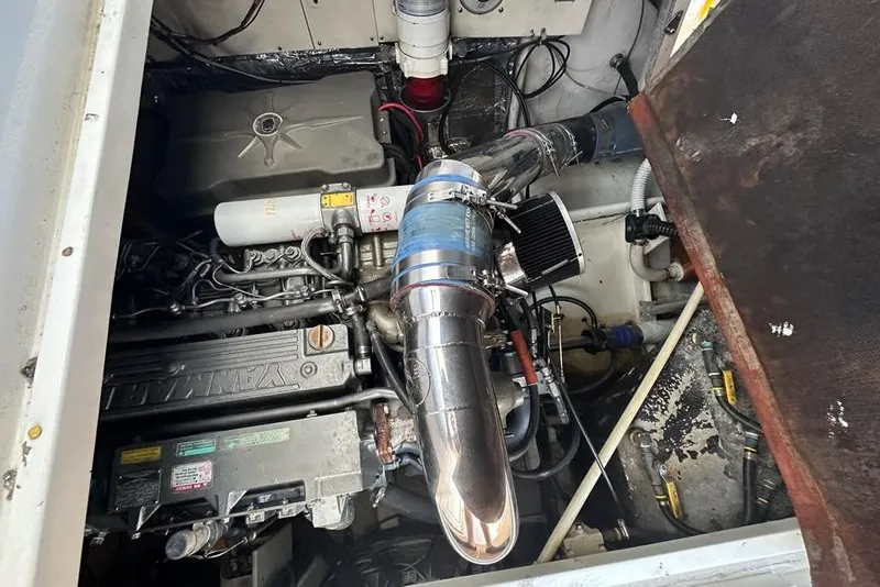 Slide: The Image of Engine compartment of a 2001 Jupiter 35 Convertible boat, showcasing mechanical components. - 28