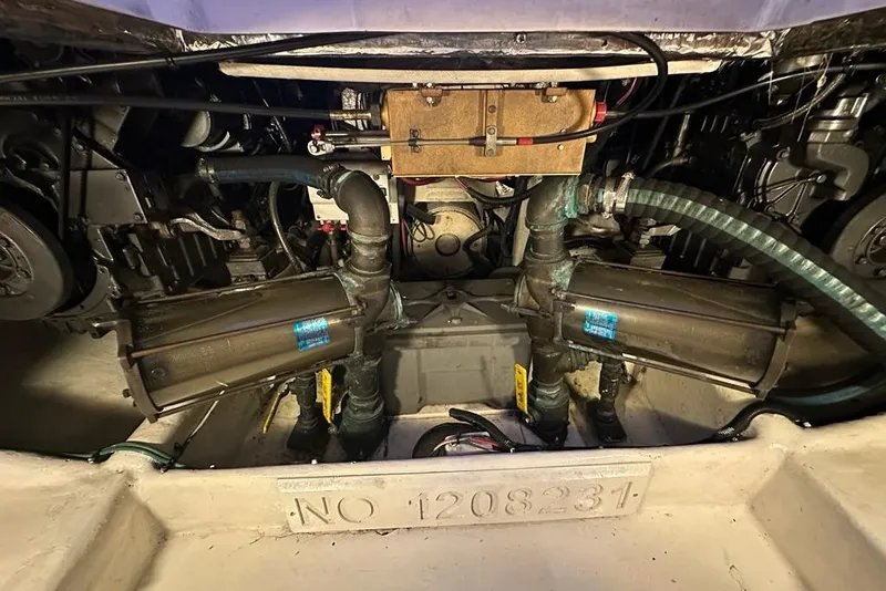 Slide: The Image of Engine room of a 2001 Jupiter 35 Convertible boat, showcasing mechanical components. - 29