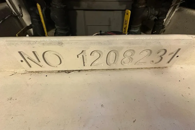 Slide: The Image of Engraved number "NO 1208231" on a 2001 Jupiter 35 Convertible boat. - 33