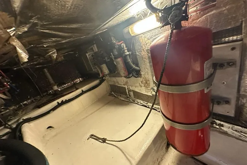 Slide: The Image of Engine room of 2001 Jupiter 35 Convertible with fire extinguisher and wiring. - 34