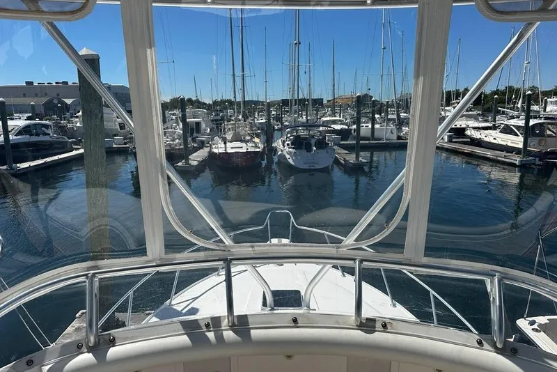 Slide: The Image of View from 2001 Jupiter 35 Convertible yacht in a marina, surrounded by boats. - 39