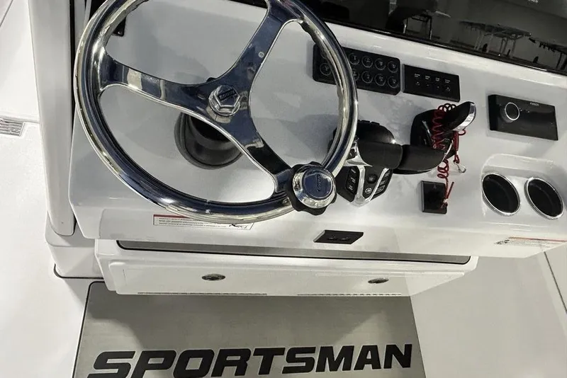Slide: The Image of 2026 Sportsman Heritage 321 Center Console with twin 450 V8 engines in showroom. - 12