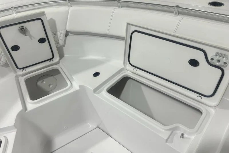 Slide: The Image of 2026 Sportsman Heritage 321 Center Console boat on trailer in showroom. - 13