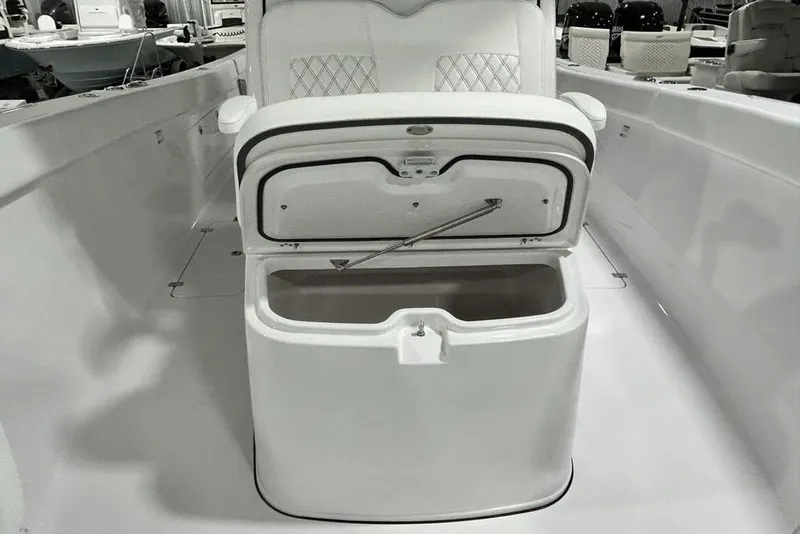 Slide: The Image of 2026 Sportsman Heritage 321 Center Console boat interior in showroom. - 14