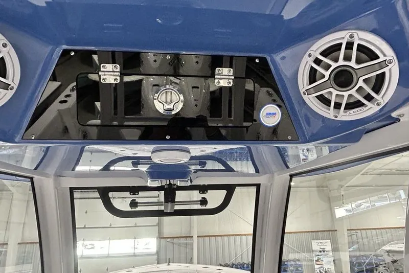 Slide: The Image of Anchor compartment of 2026 Sportsman Heritage 321 Center Console boat, open hatch view. - 17