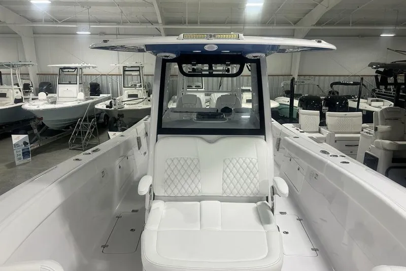 Slide: The Image of Luxurious seating on the 2026 Sportsman Heritage 321 Center Console boat, featuring elegant white upholstery. - 18