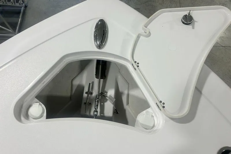 Slide: The Image of 2026 Sportsman Heritage 321 Center Console boat interior with white cushioned seating. - 21