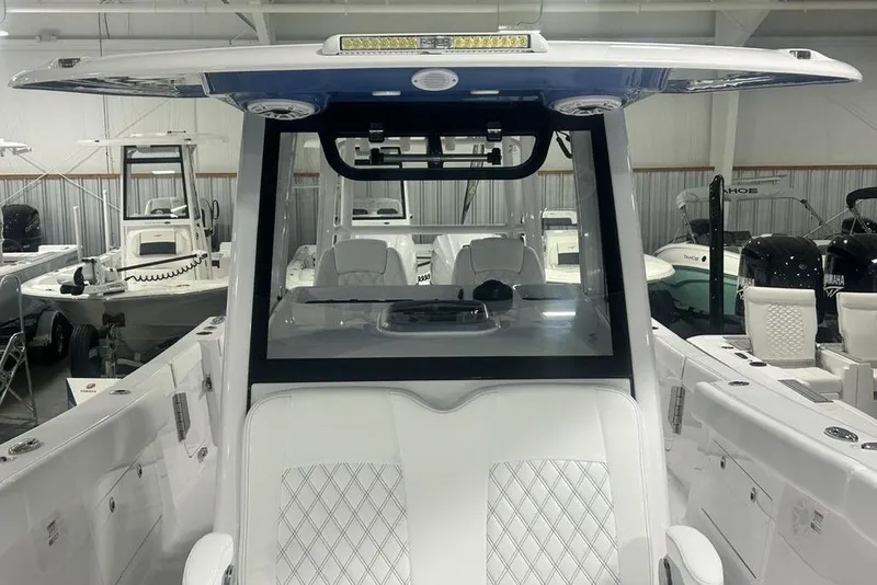 Slide: The Image of 2026 Sportsman Heritage 321 Center Console with luxurious seating and sleek steering wheel design. - 22