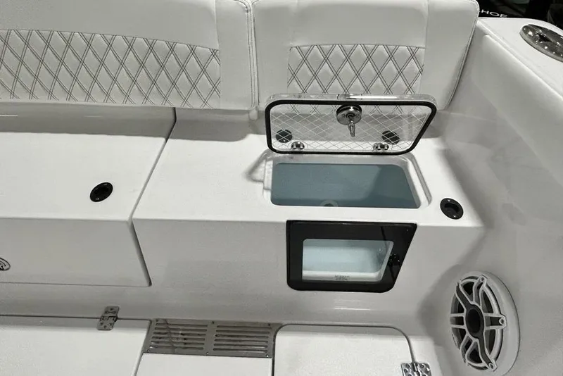 Slide: The Image of 2026 Sportsman Heritage 321 Center Console boat with open storage compartment. - 24