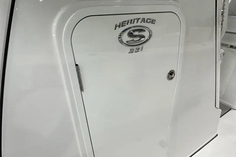 Slide: The Image of 2026 Sportsman Heritage 321 Center Console boat interior with modern design and seating. - 29