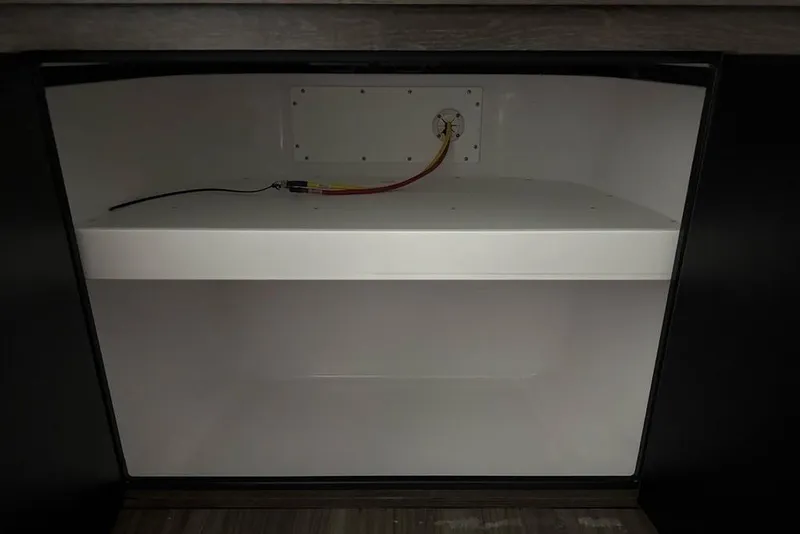 Slide: The Image of Empty storage compartment in 2026 Sportsman Heritage 321 Center Console boat. - 36