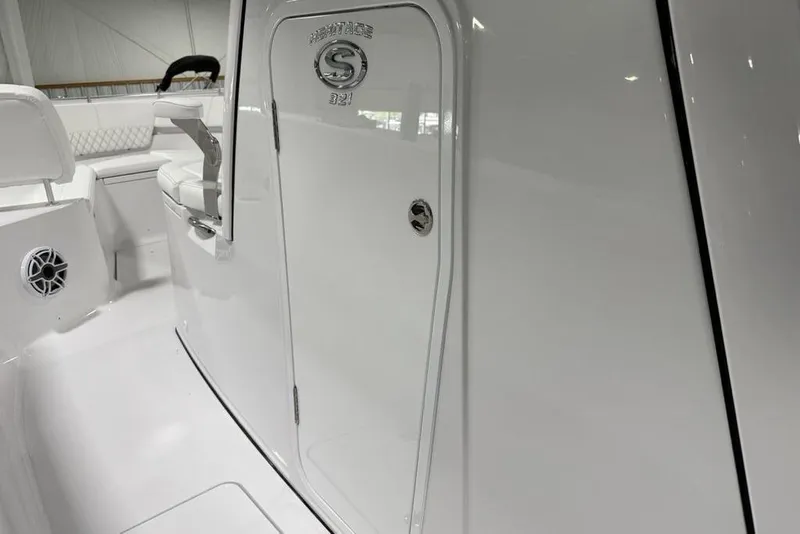 Slide: The Image of 2026 Sportsman Heritage 321 Center Console interior, showcasing sleek white design and seating. - 38