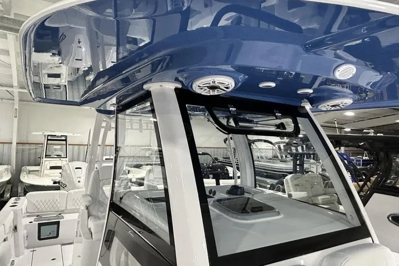 Slide: The Image of 2026 Sportsman Heritage 321 Center Console boat interior with sleek design and modern features. - 39