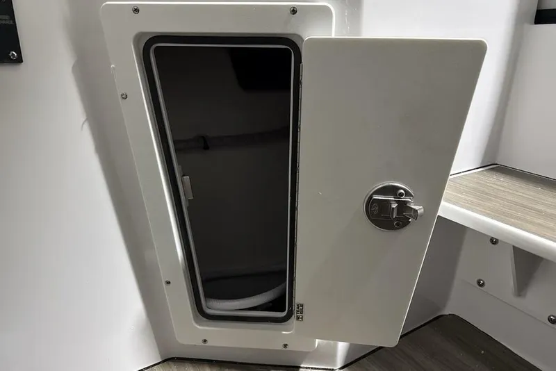 Slide: The Image of Open storage compartment on 2026 Sportsman Heritage 321 Center Console boat. - 40