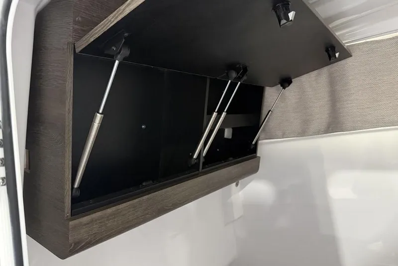 Slide: The Image of Open storage compartment in 2026 Sportsman Heritage 321 Center Console boat. - 42