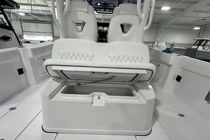Slide: The Image of 2026 Sportsman Heritage 321 Center Console interior with open storage compartment. - 48