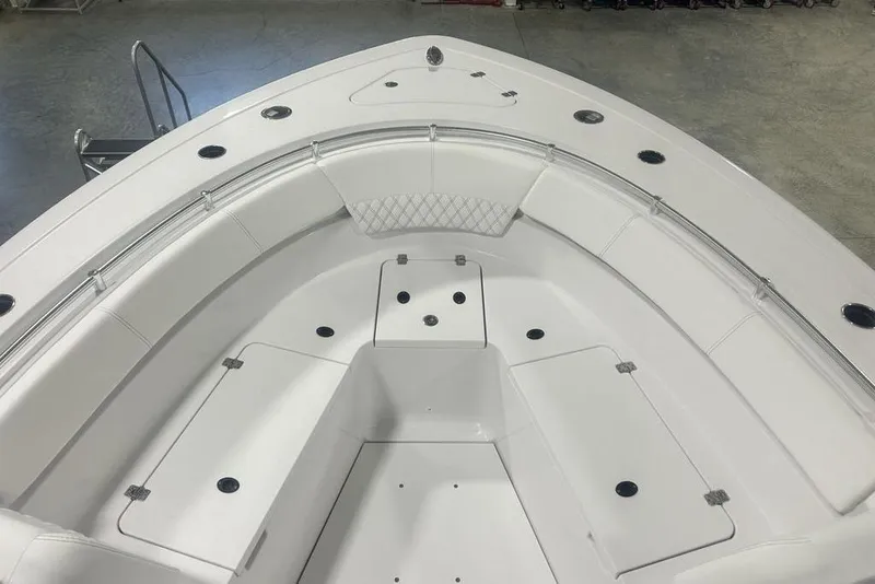 Slide: The Image of 2026 Sportsman Heritage 321 Center Console boat in showroom, front view. - 5