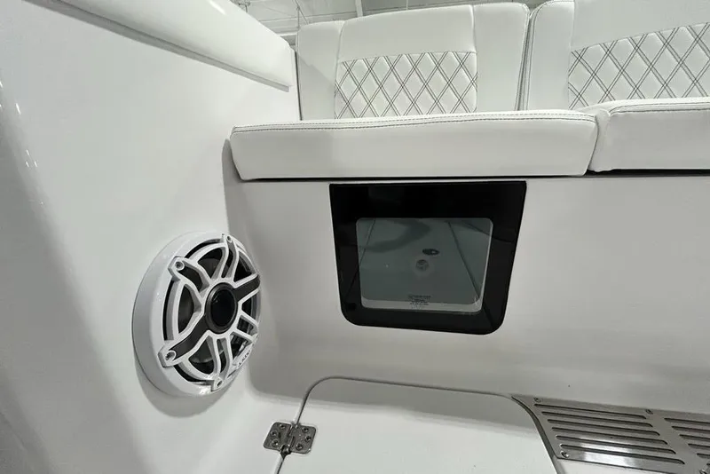 Slide: The Image of 2026 Sportsman Heritage 321 Center Console interior with speaker and cushioned seating. - 51
