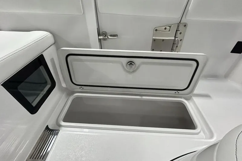 Slide: The Image of Open storage compartment on 2026 Sportsman Heritage 321 Center Console boat. - 53