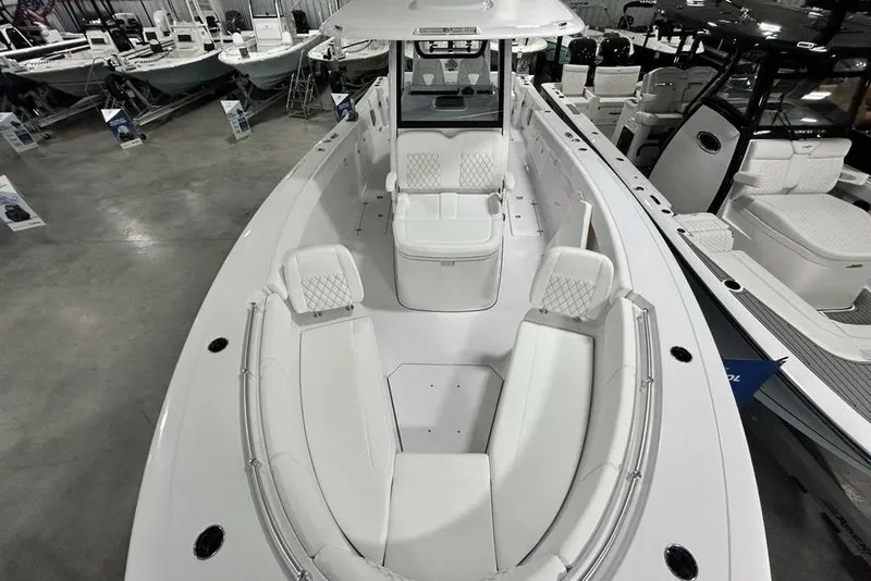 Slide: The Image of 2026 Sportsman Heritage 321 Center Console boat with sleek white interior and spacious seating. - 58