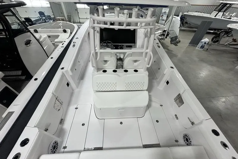 Slide: The Image of 2026 Sportsman Heritage 321 Center Console boat interior, featuring sleek white design and modern amenities. - 60