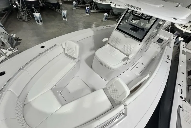 Slide: The Image of 2026 Sportsman Heritage 321 Center Console boat with spacious seating and modern design. - 63