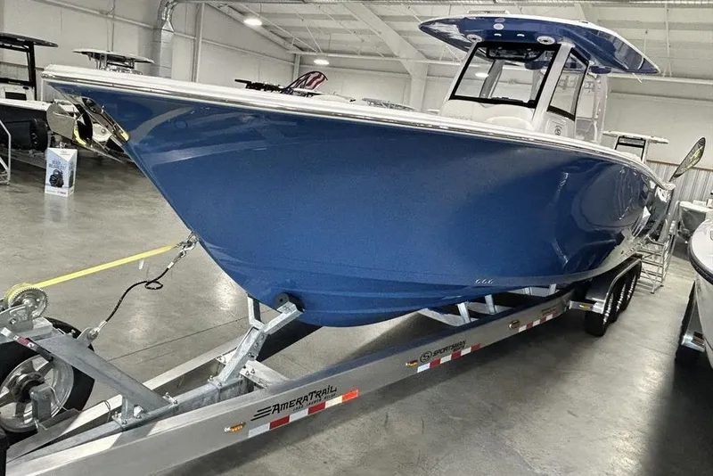 Slide: The Image of 2026 Sportsman Heritage 321 Center Console boat with luxurious white seating and modern design. - 9