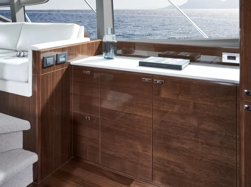 Slide: The Image of Luxurious interior of 2025 Princess F50 yacht with wooden cabinetry and ocean view. - 18