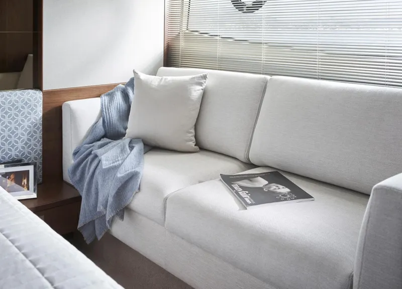 Slide: The Image of Modern interior of Princess F50 yacht 2025 with cozy sofa and decor. - 28