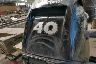 Slide: The Image of 2020 Grizzly 1754 SC boat with Mercury 40 HP outboard motor in workshop. - 3