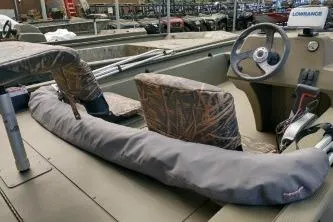 Slide: The Image of 2020 Grizzly 1754 SC boat interior with camo seats and steering console. - 5