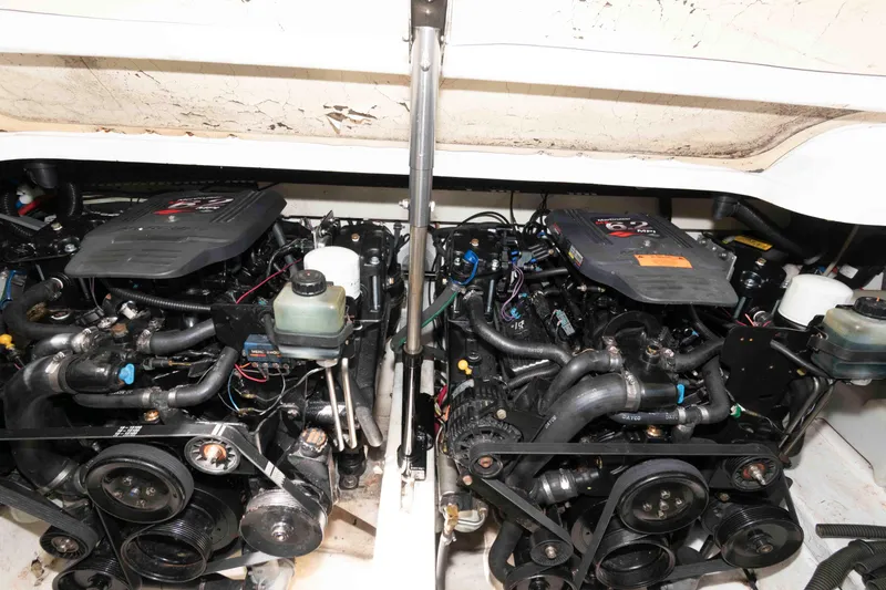 Slide: The Image of Engine compartment of a 2002 Formula 31 Performance Cruiser, showcasing dual engines and components. - 12