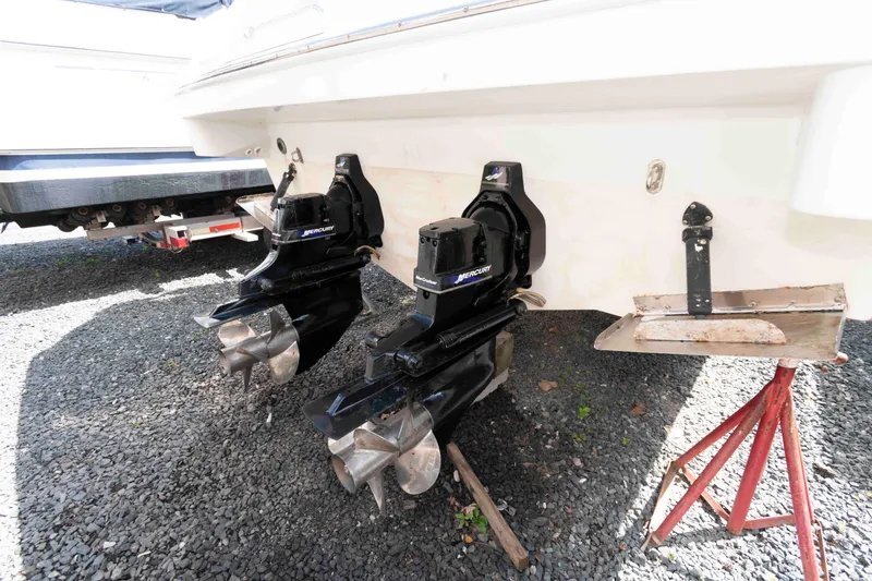 Slide: The Image of 2002 Formula 31 Performance Cruiser with dual Mercury outboard motors on gravel. - 14