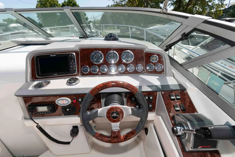 Slide: The Image of 2002 Formula 31 Performance Cruiser dashboard with wood accents and modern controls. - 5