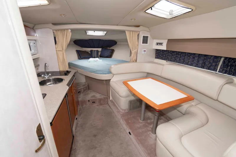 Slide: The Image of Interior of 2002 Formula 31 Performance Cruiser with kitchenette and cozy seating area. - 8