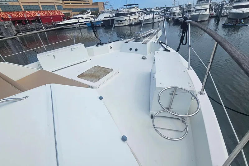 Slide: The Image of 1990 Hatteras 67 Cockpit Motor Yacht deck view at marina. - 17