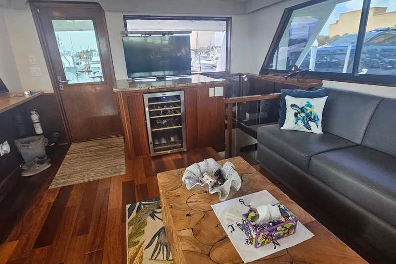 Slide: The Image of Luxurious interior of 1990 Hatteras 67 Cockpit Motor Yacht with modern amenities. - 23