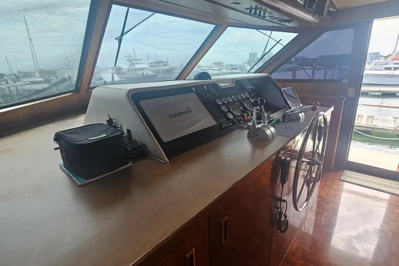 Slide: The Image of Interior helm of 1990 Hatteras 67 Cockpit Motor Yacht with Garmin navigation system. - 29